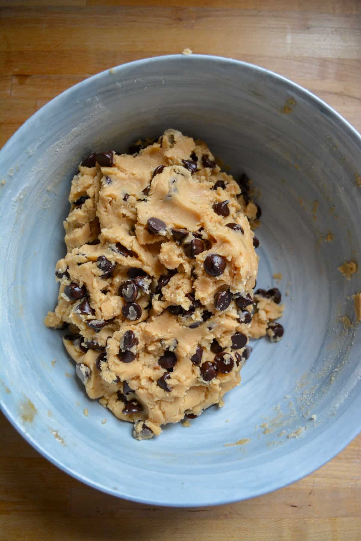 The finished coconut oil chocolate chip cookie dough in a bowl.