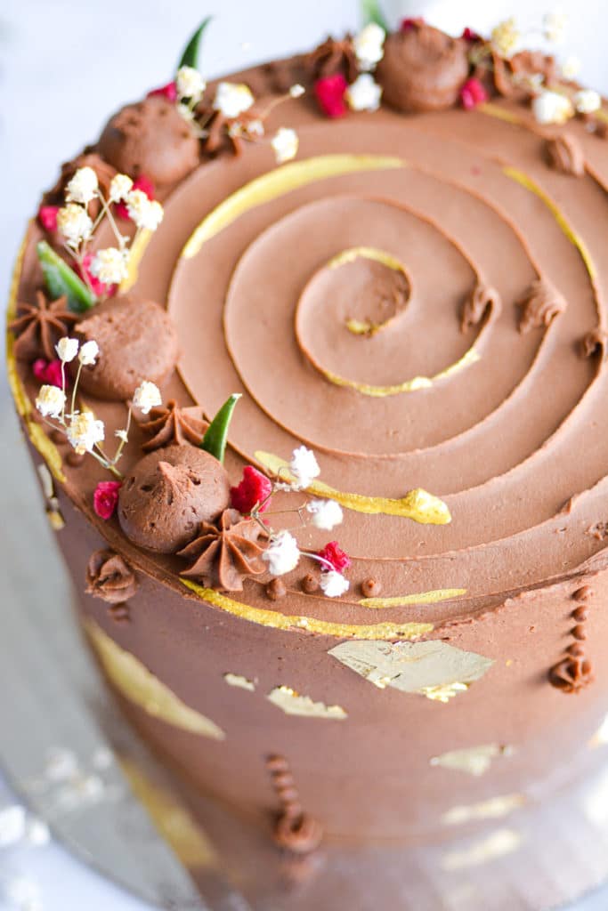 Close up of a cake frosted with Vegan Chocolate Buttercream Frosting