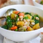 close up of Vegan Acorn Squash stew in a white bowl