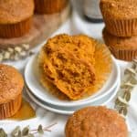 Vegan Pumpkin Muffin cut in half to show the interior.