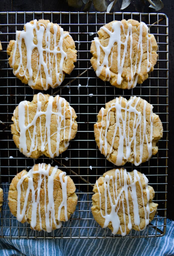 glazed scickerdoodle cookies on a cooling rack