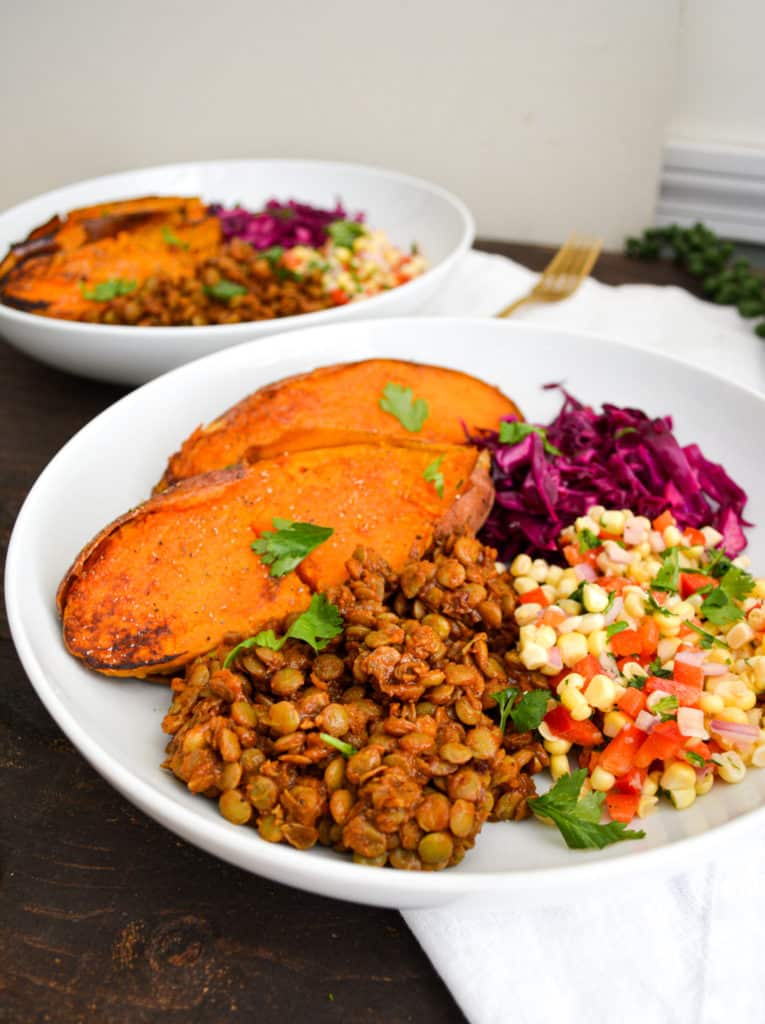 Quick + Smoky Barbecue Lentils in a bowl with sweet potatoes and corn salsa