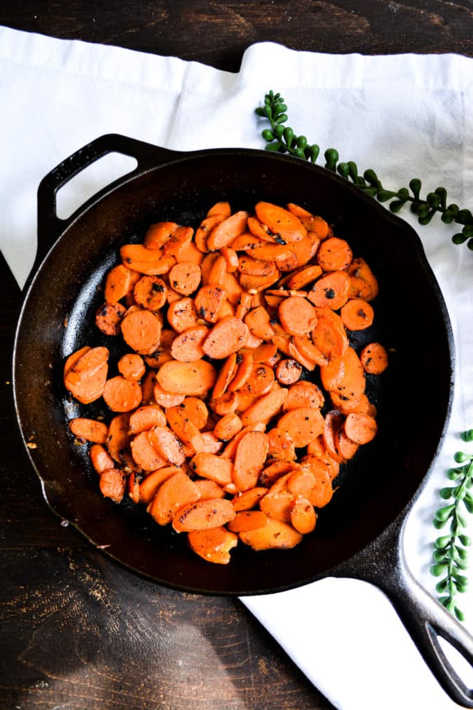 Caramelized Maple Mustard Carrots in a cast iron pan