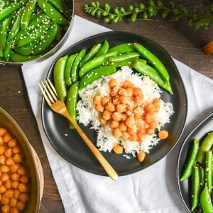 Plates of rice with chickpeas and snap peas