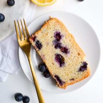 Close up of a slice of blueberry lemon bread