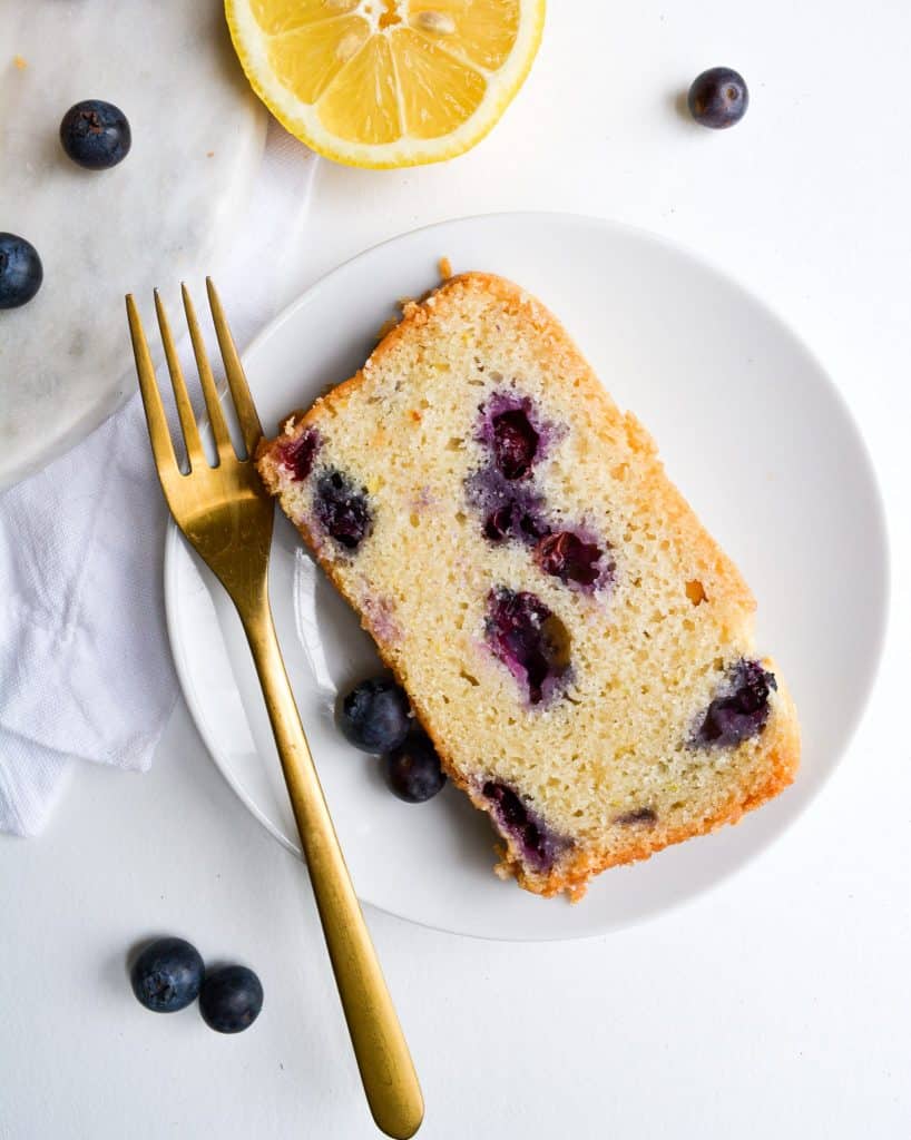Close up of a slice of blueberry lemon bread