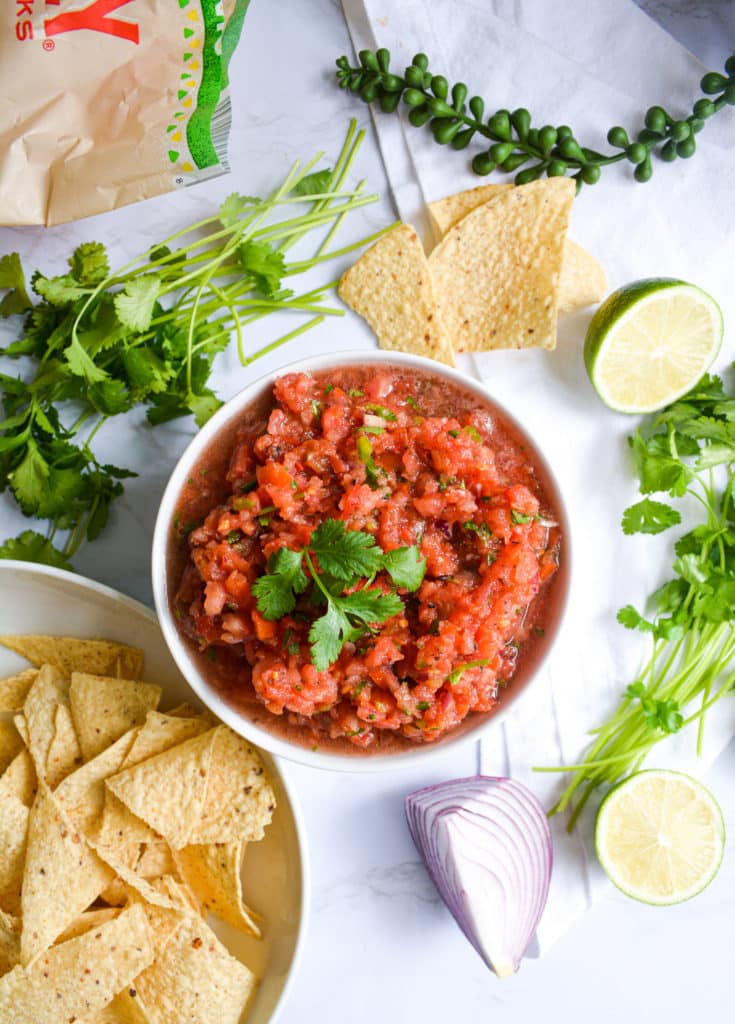 A bowl of Thick Restaurant Style salsa with chips