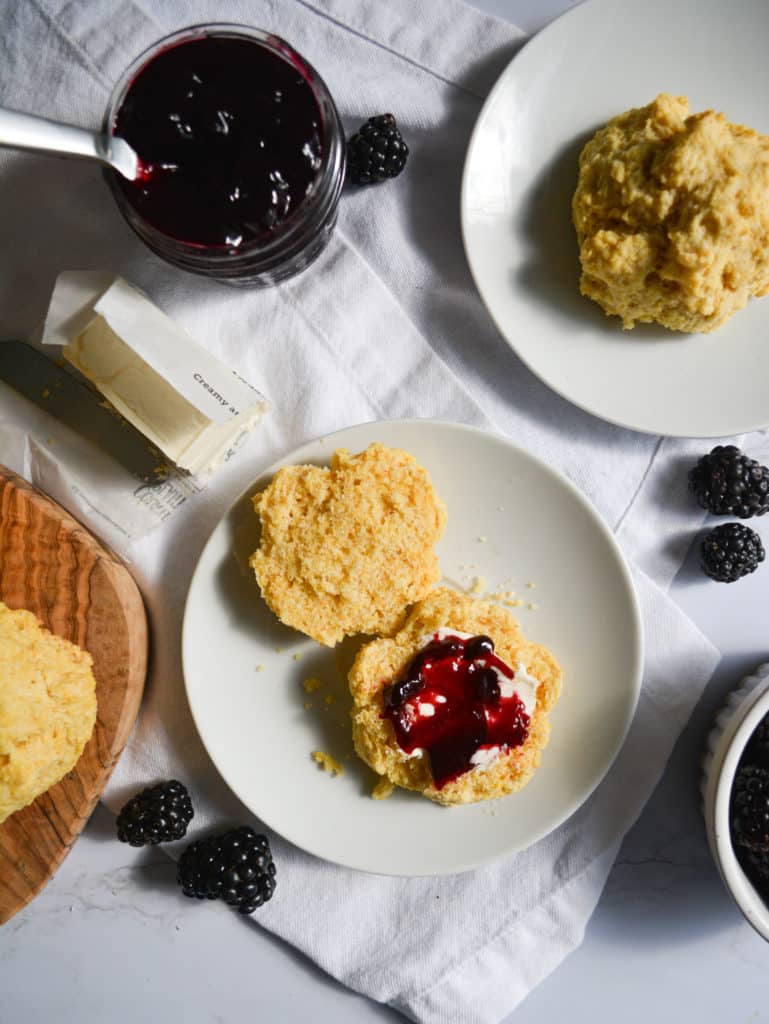 Portrait of two Fluffy Cornmeal Drop Biscuits on plates