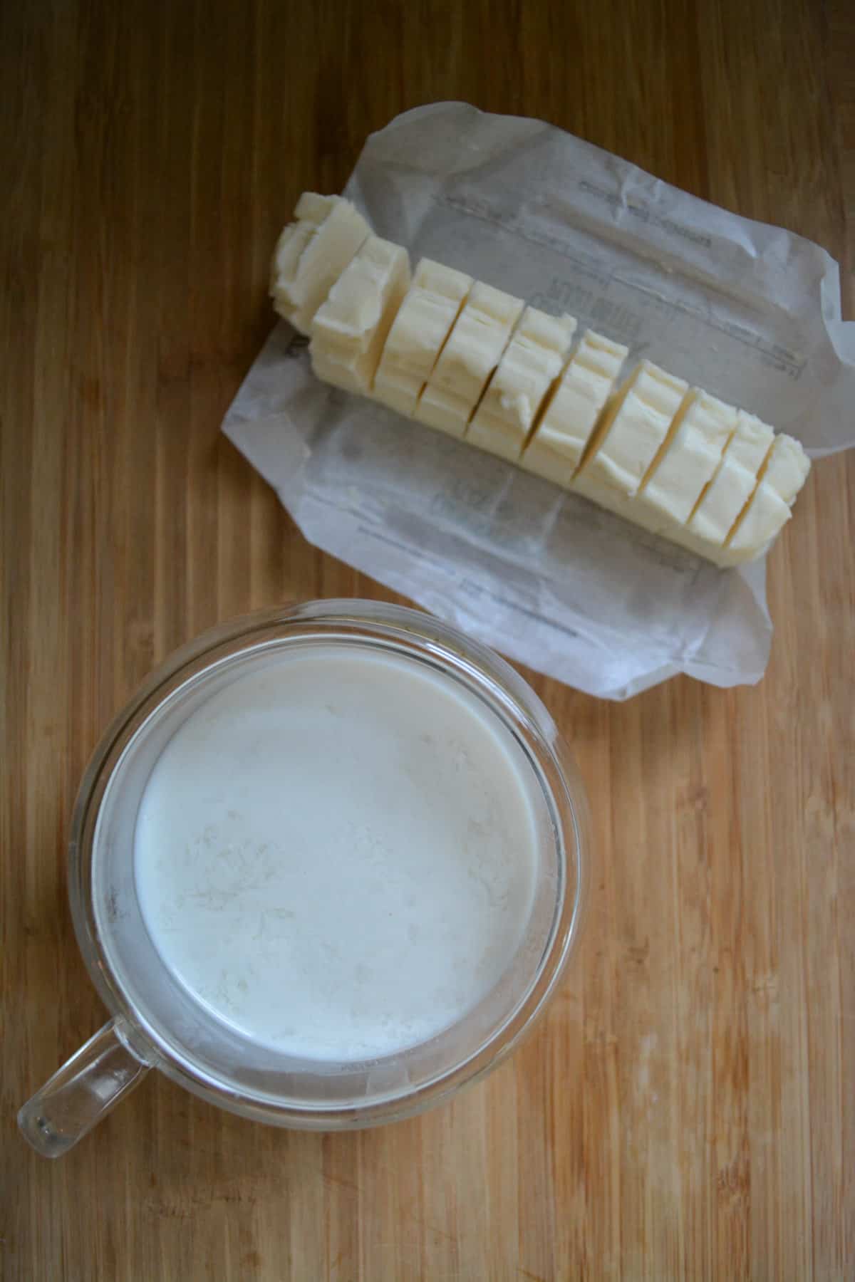 Overhead shot of cubed vegan butter and non-dairy buttermilk milk