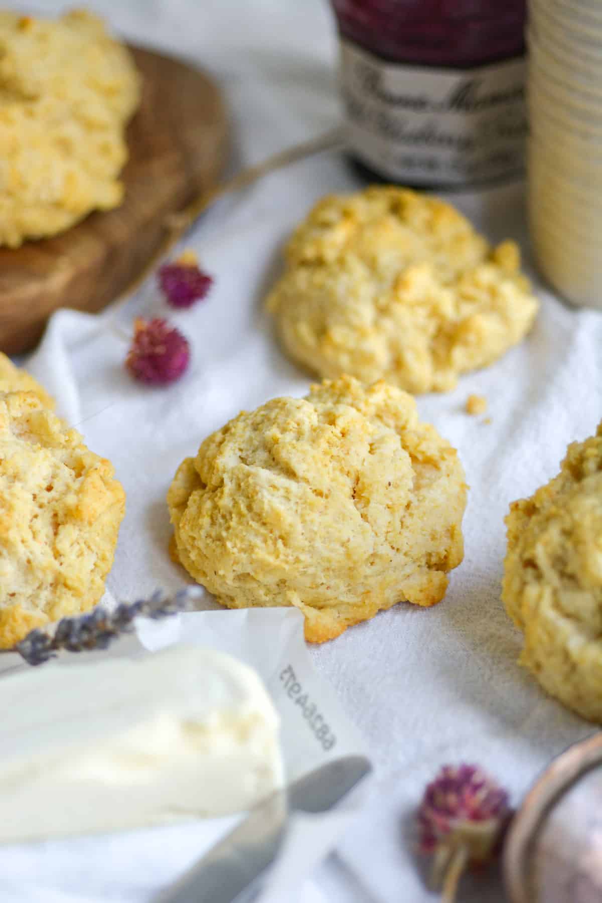 Vegan fluffy cornmeal drop biscuits on a white cloth