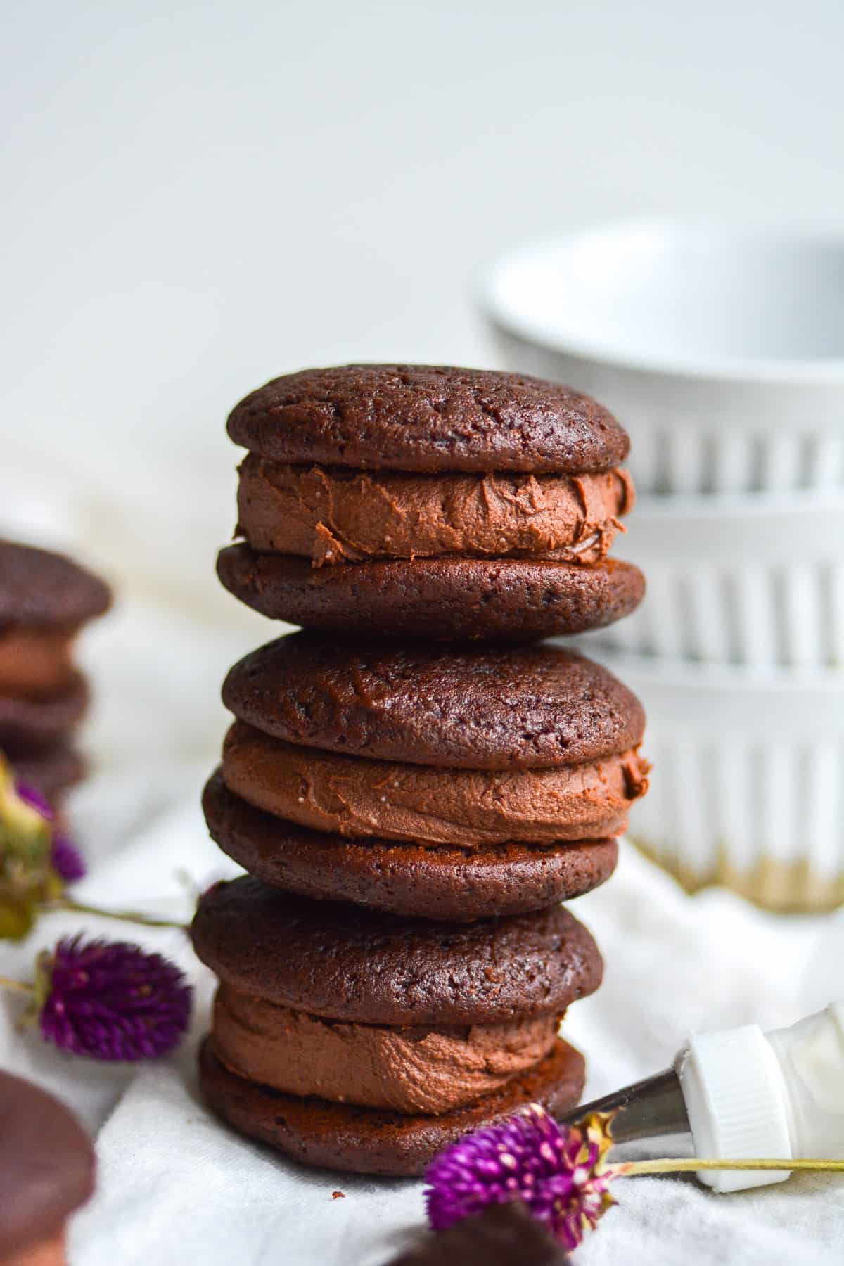 a stack of three filled cookies
