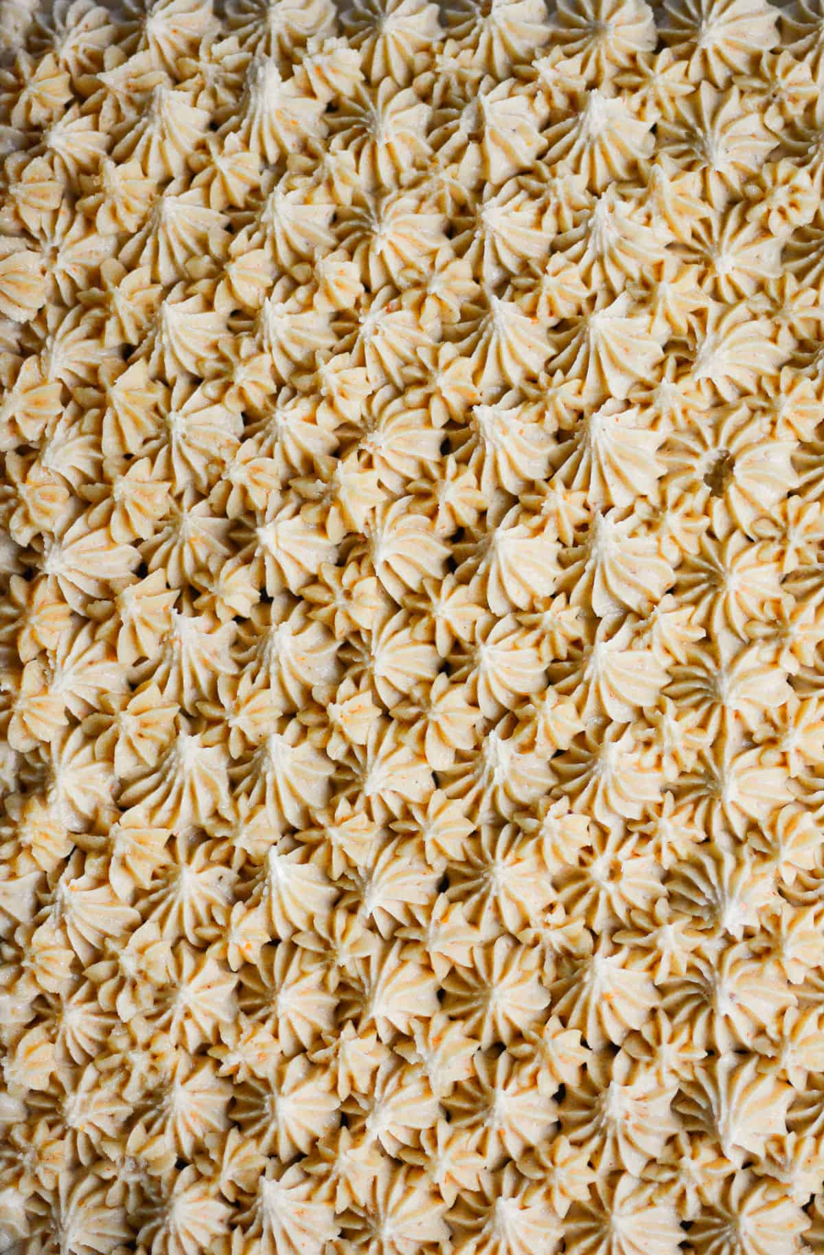Close up of piped Vegan Peanut Butter Frosting.