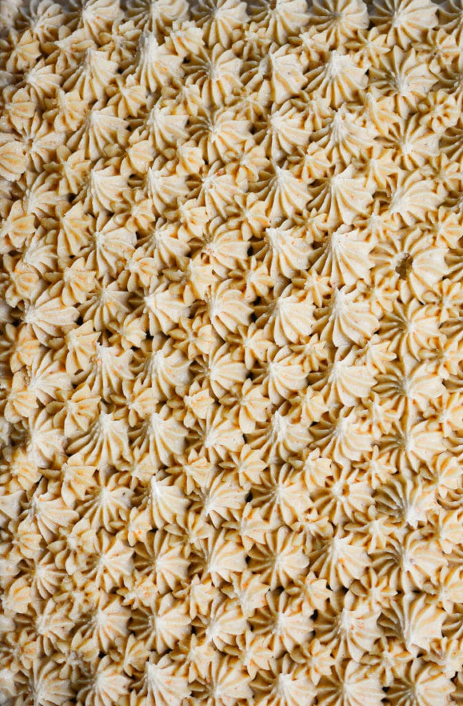 close up of piped peanut butter frosting