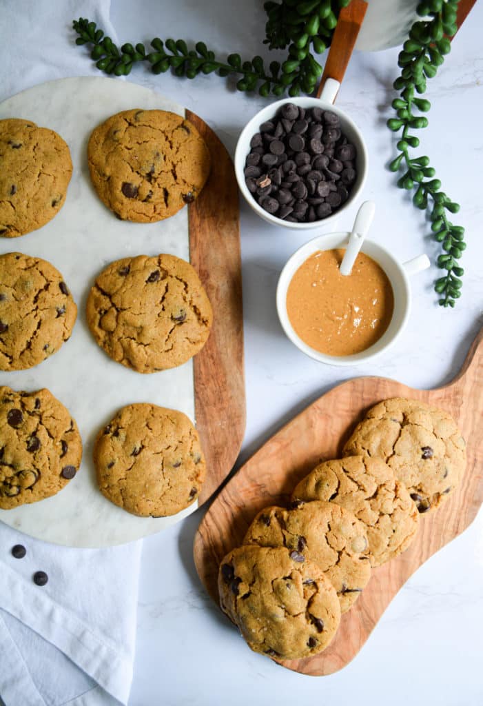 Peanut Butter Chocolate Chip Cookies on a marble board and wooden board