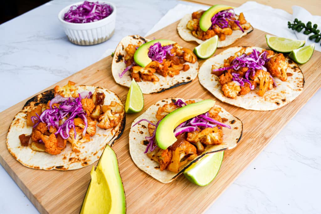 Chipotle Agave Cauliflower Tacos on a wooden board