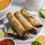 finished vegan gluten-free air fryer taquitos on a plate