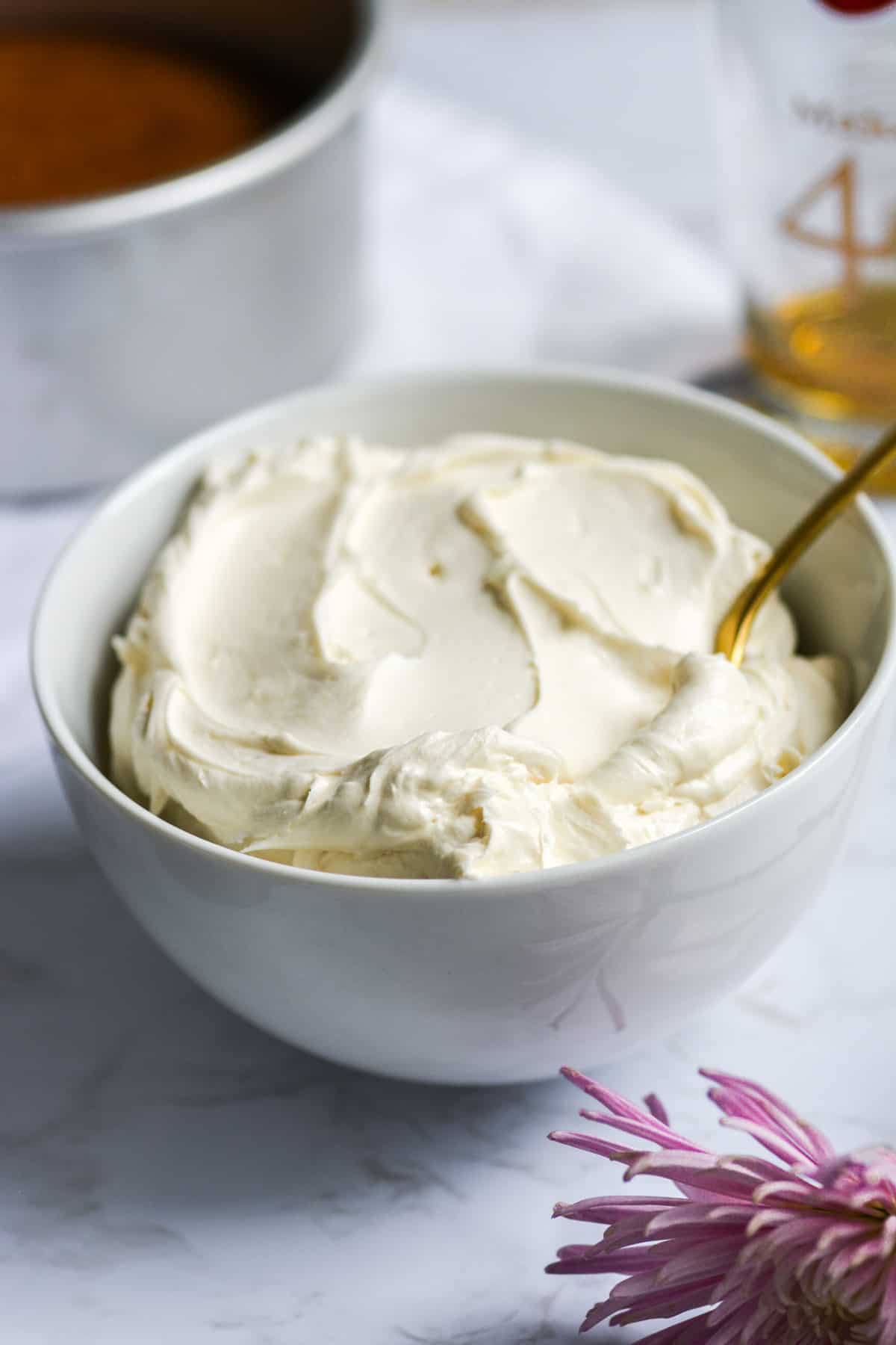 Maple Bourbon Buttercream frosting in a white bowl