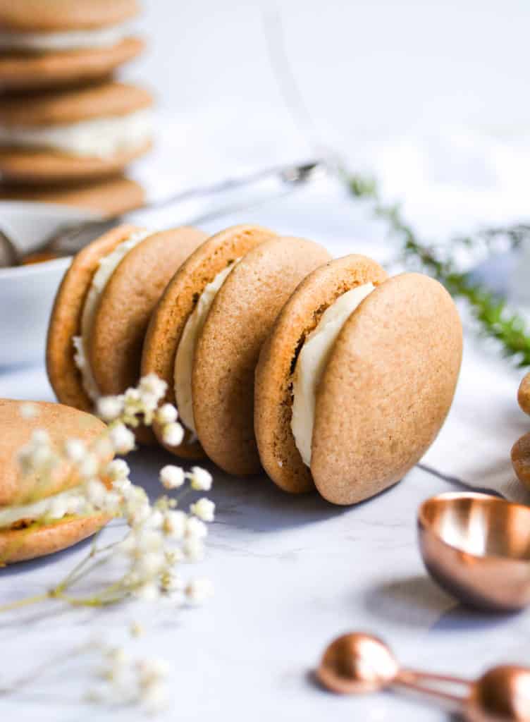 Close up of three one-bowl chai spiced whoopie pies on a white background