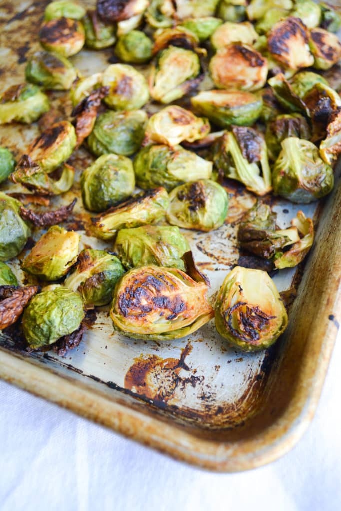 Roasted Maple Dijob Brussels Sprouts on a metal sheet pan