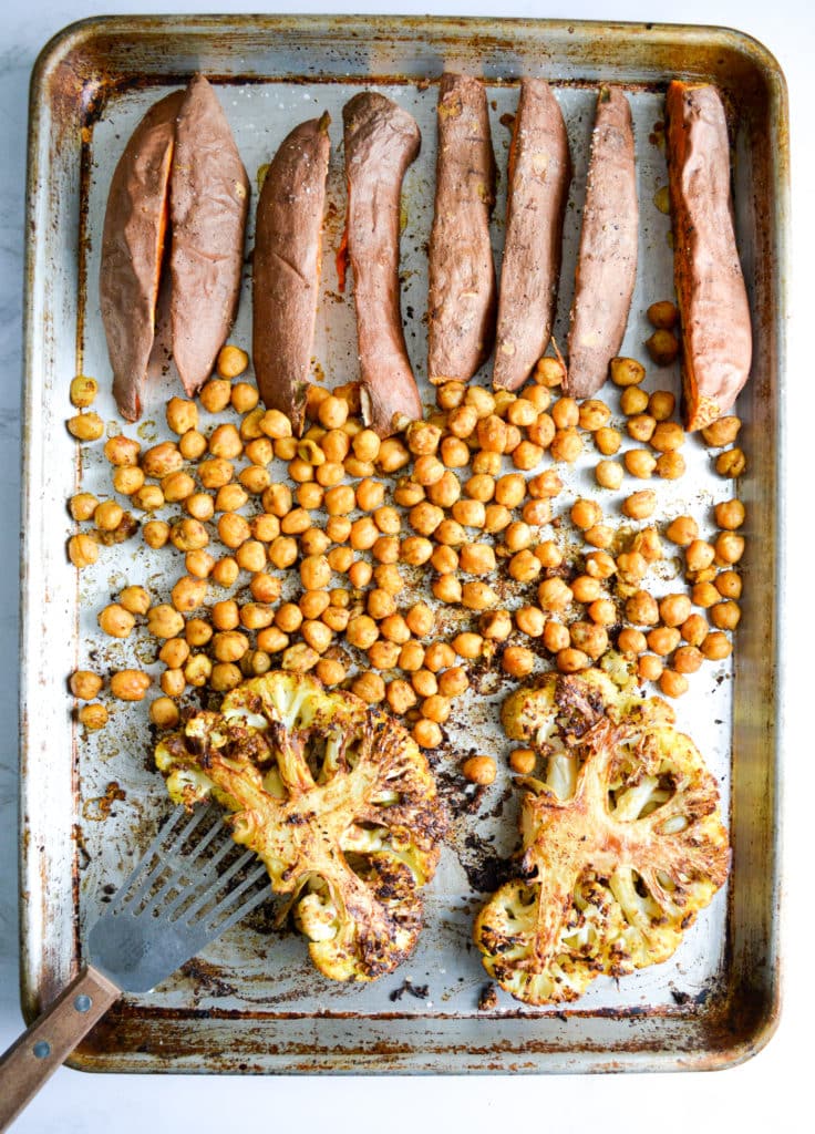 Sweet Potatoes, spiced chickpeas and 2 cauliflower steaks on a sheety pan