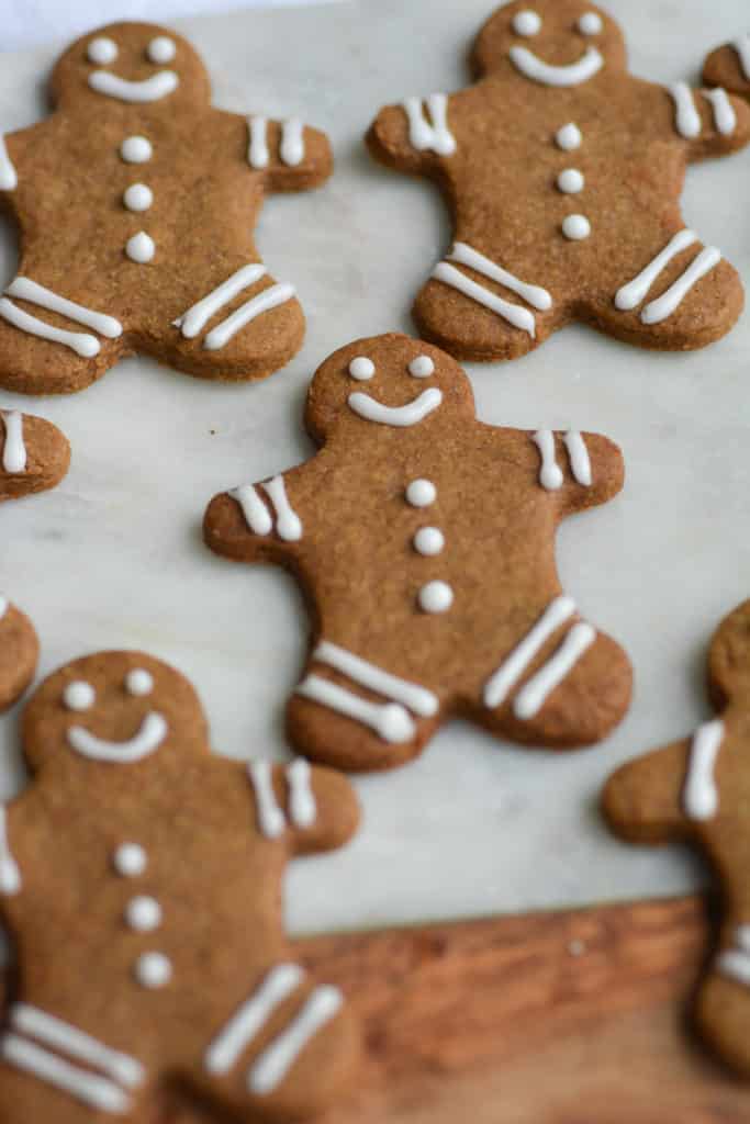 Close up of gingerbread cookies on a marble cutting board