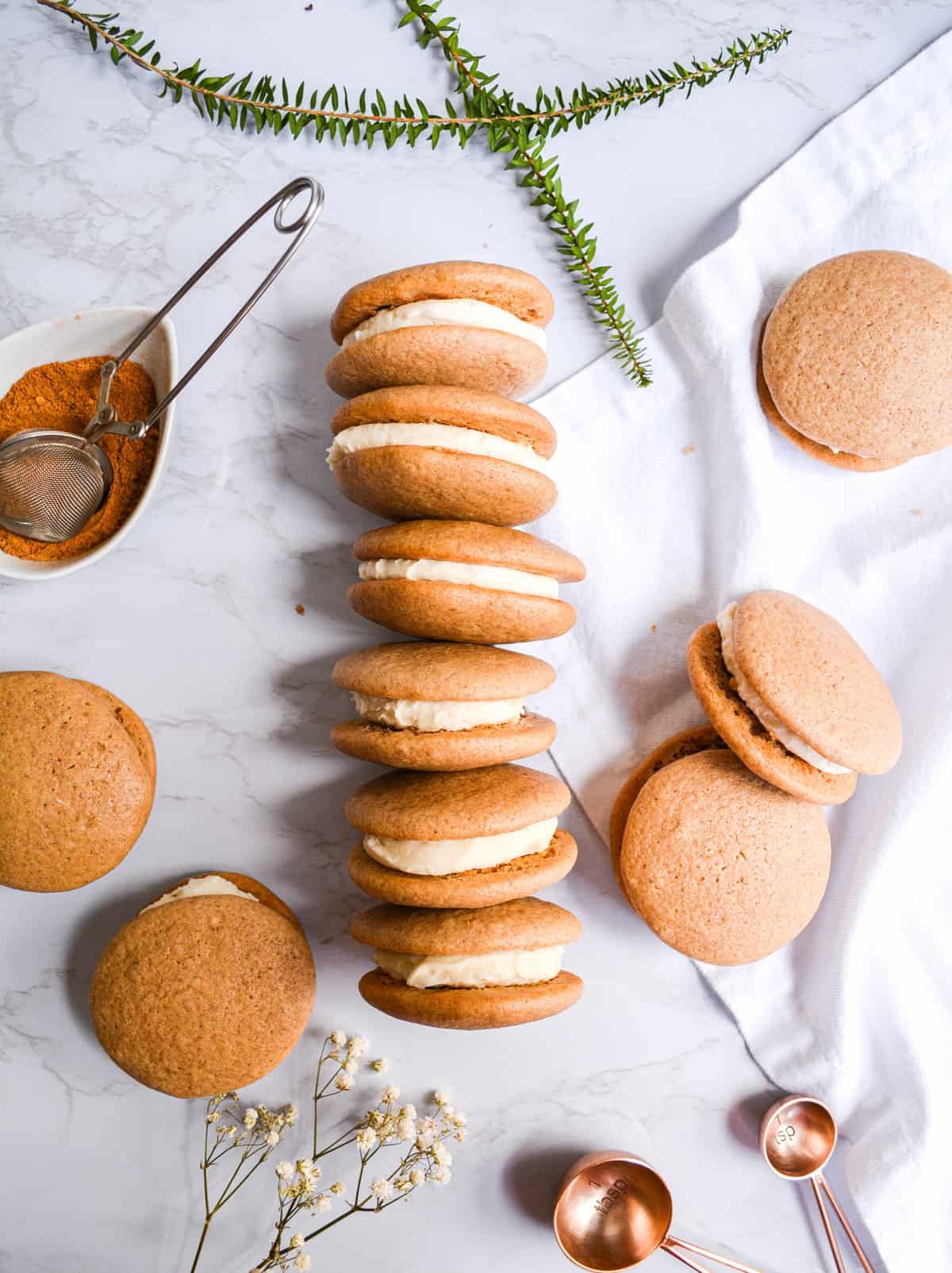Vegan Chai Whoopie Pies  laid in a row on a marble board