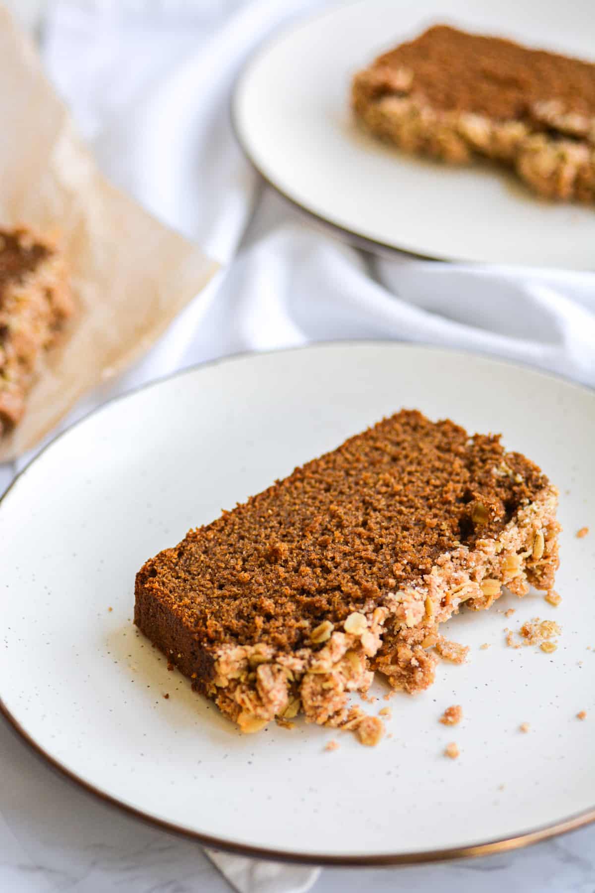two slices of vegan gingerbread loaf on a plate