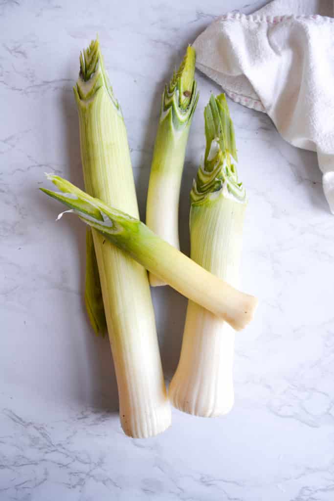 Trimmed leeks on a marble board
