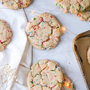 Overhead shot of Funfetti Sugar Cookies laid out on a marble board