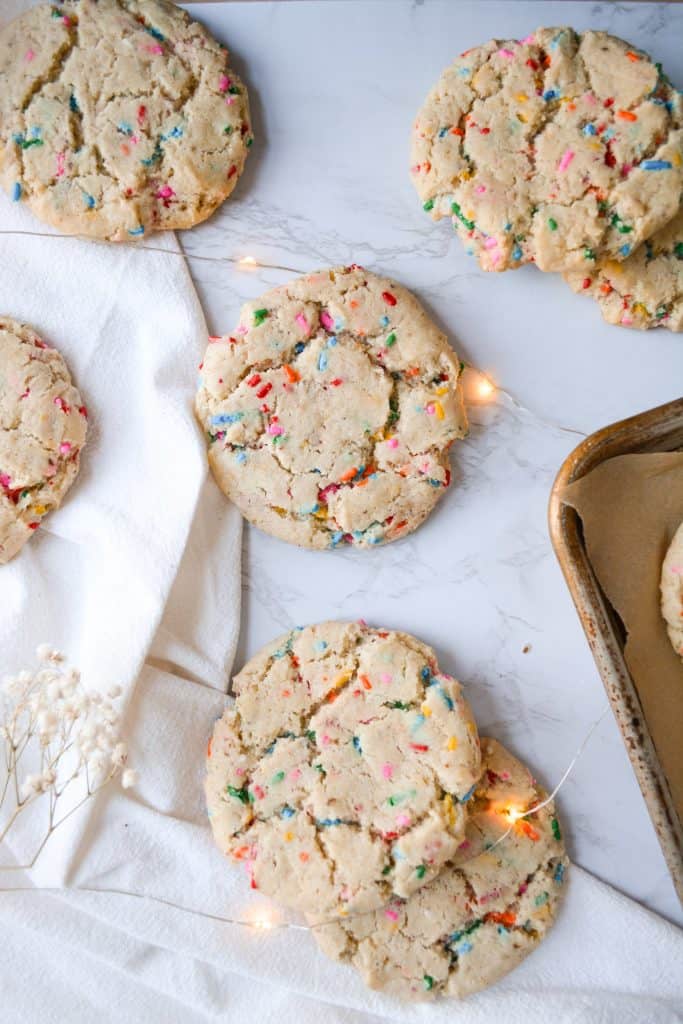 Overhead shot of Funfetti Sugar Cookies laid out on a marble board