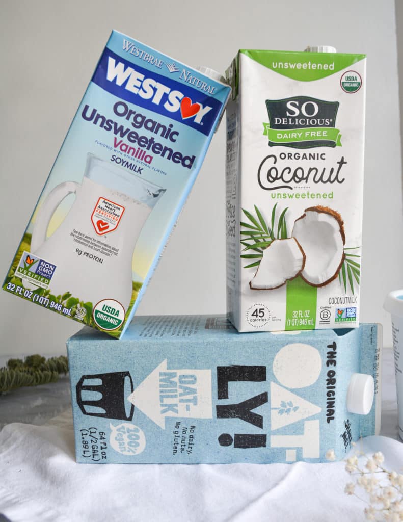 The best vegan milk products. A box of oatly, so delicious coconut milk and westsoy soymilk