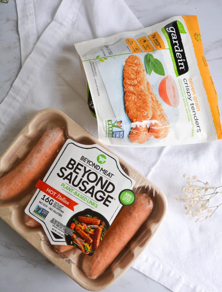 A package of beyond meat sausages and a bag of gardein chicken tenders
