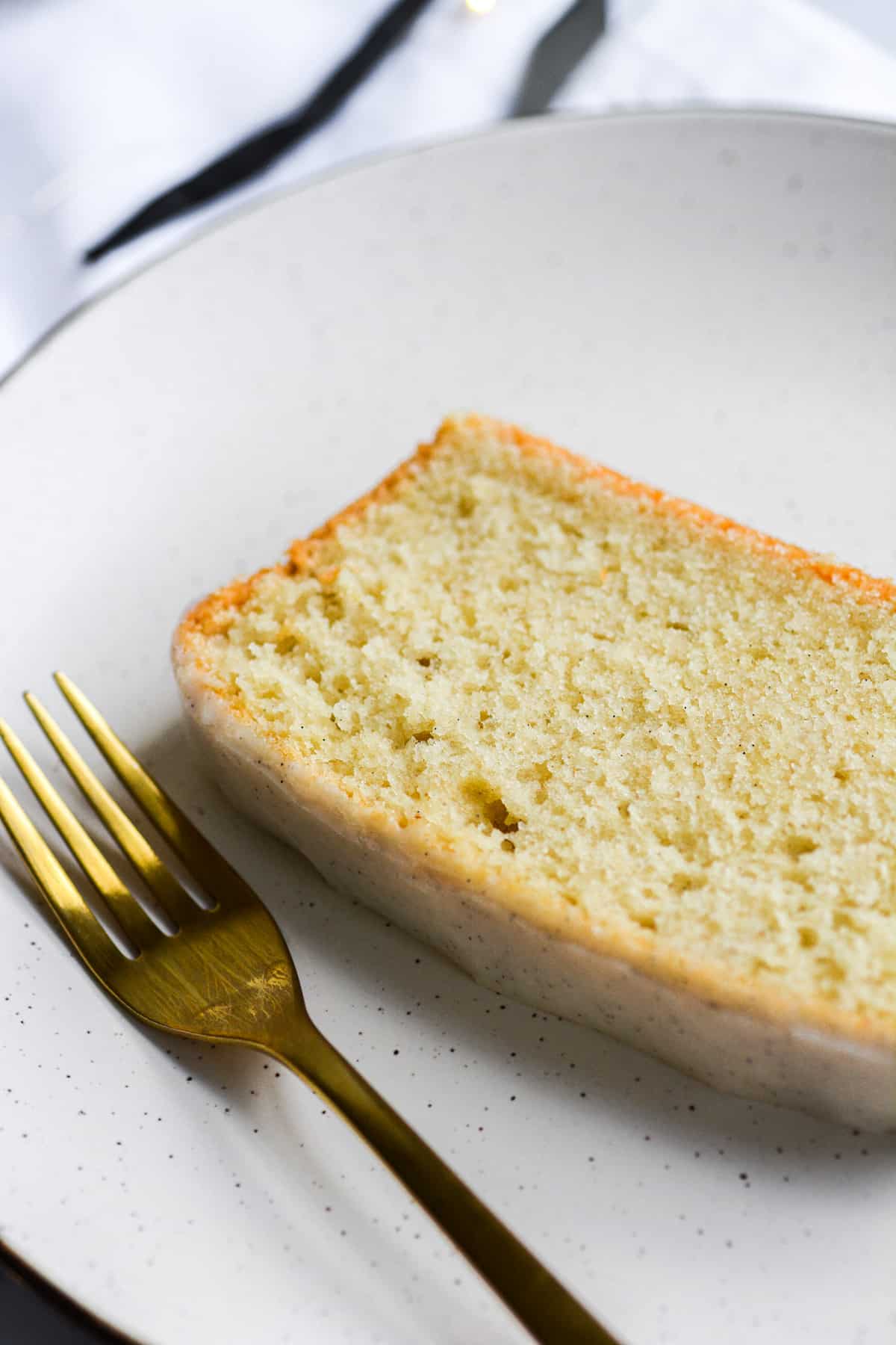Close up of a slice of pound cake on a plate