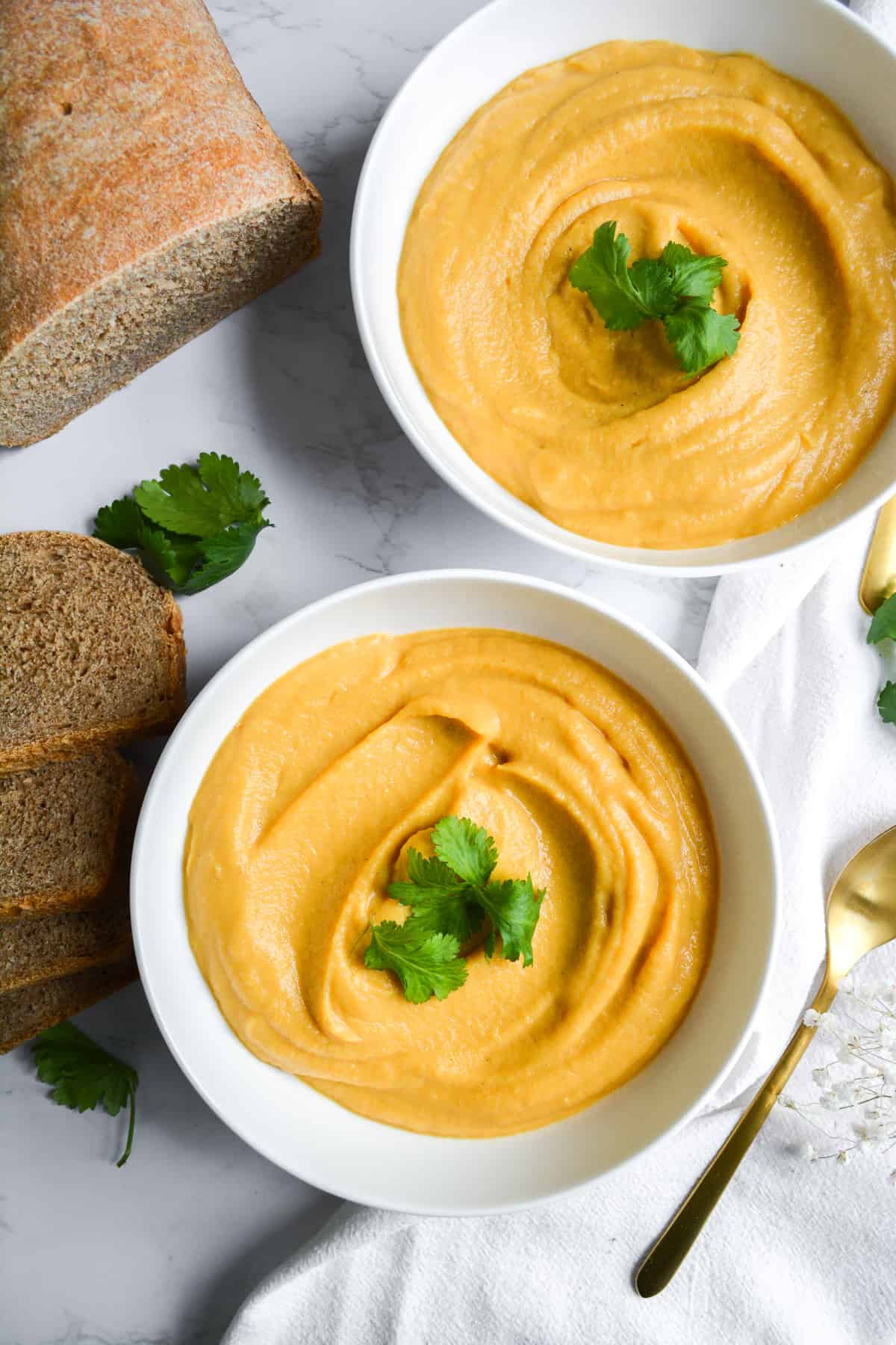 Overhead Shot of Cauliflower Red Lentil Soup in two white bowls