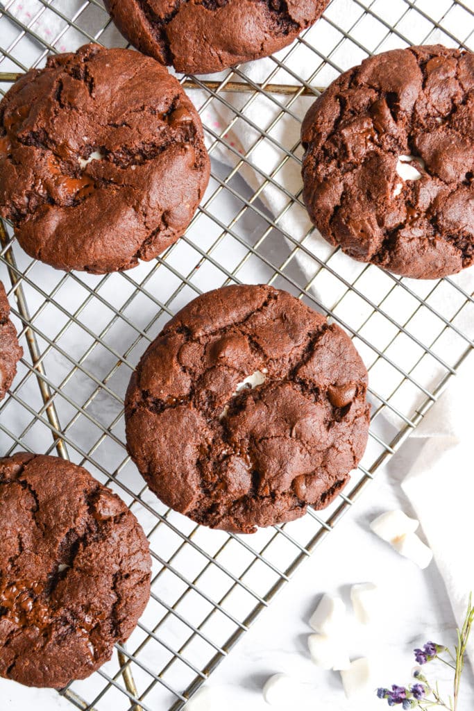 Marshmallow Stuffed Double Chocolate Cookies on a wire cooling rack