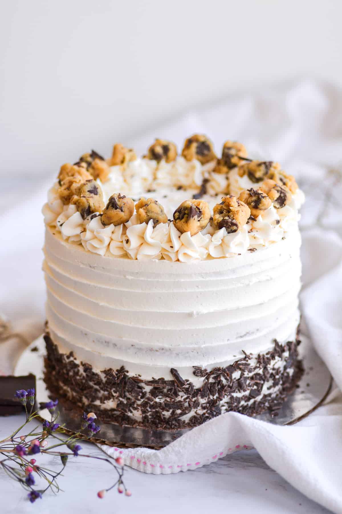 Decorated Vegan Cookie Dough cake on a white cloth