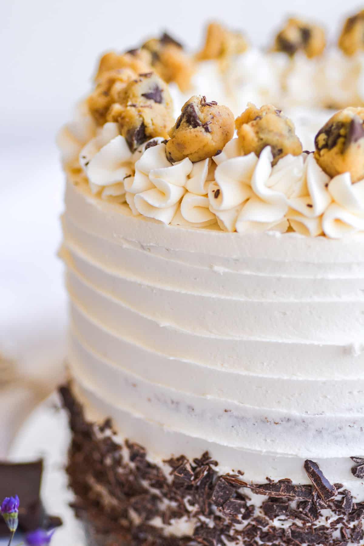 Close up of cookie dough on a decorated cake.