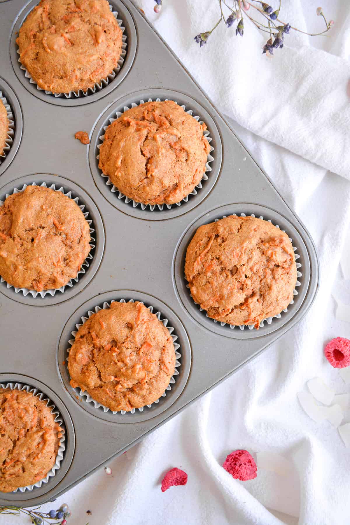 Overhead shot of vegan whole wheat carrot muffins in a muffin tin