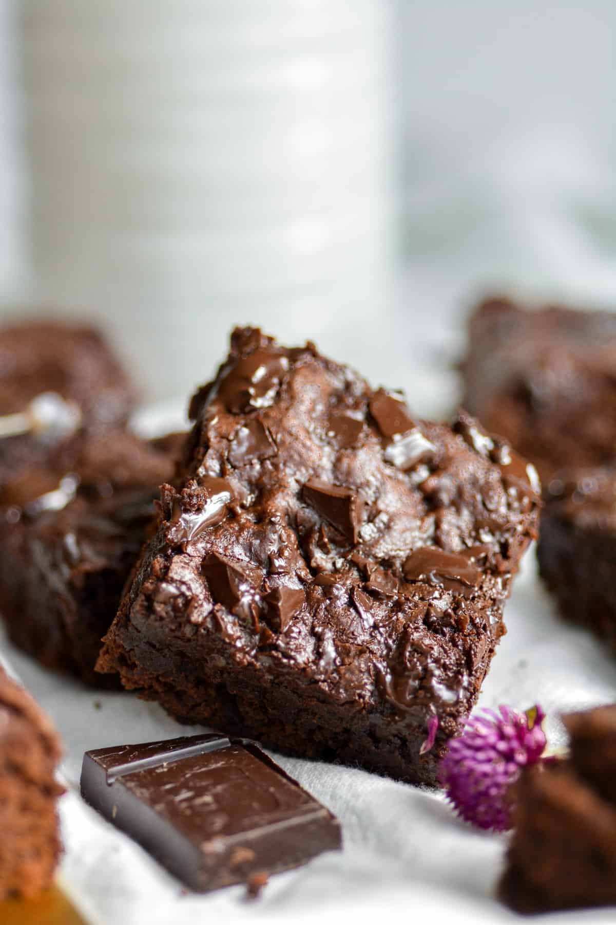 Brownies on a white cloth with chocolate chunks