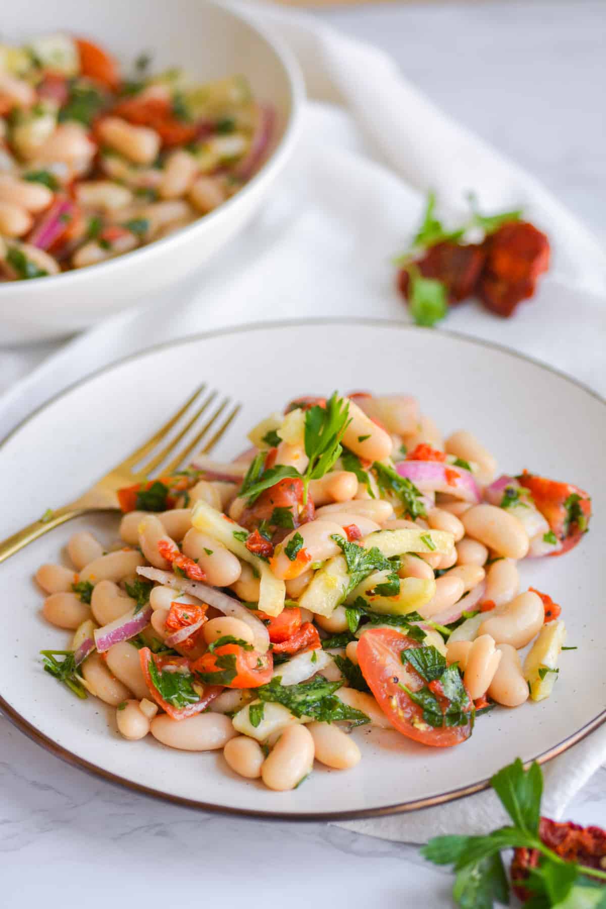 A plate with Italian white bean salad on it