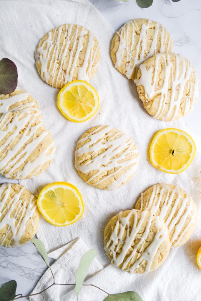 overhead shot of vegan lemon cookies on a white background