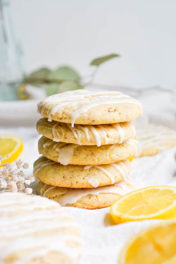 5 Vegan Lemon Cookies stacked on a white board