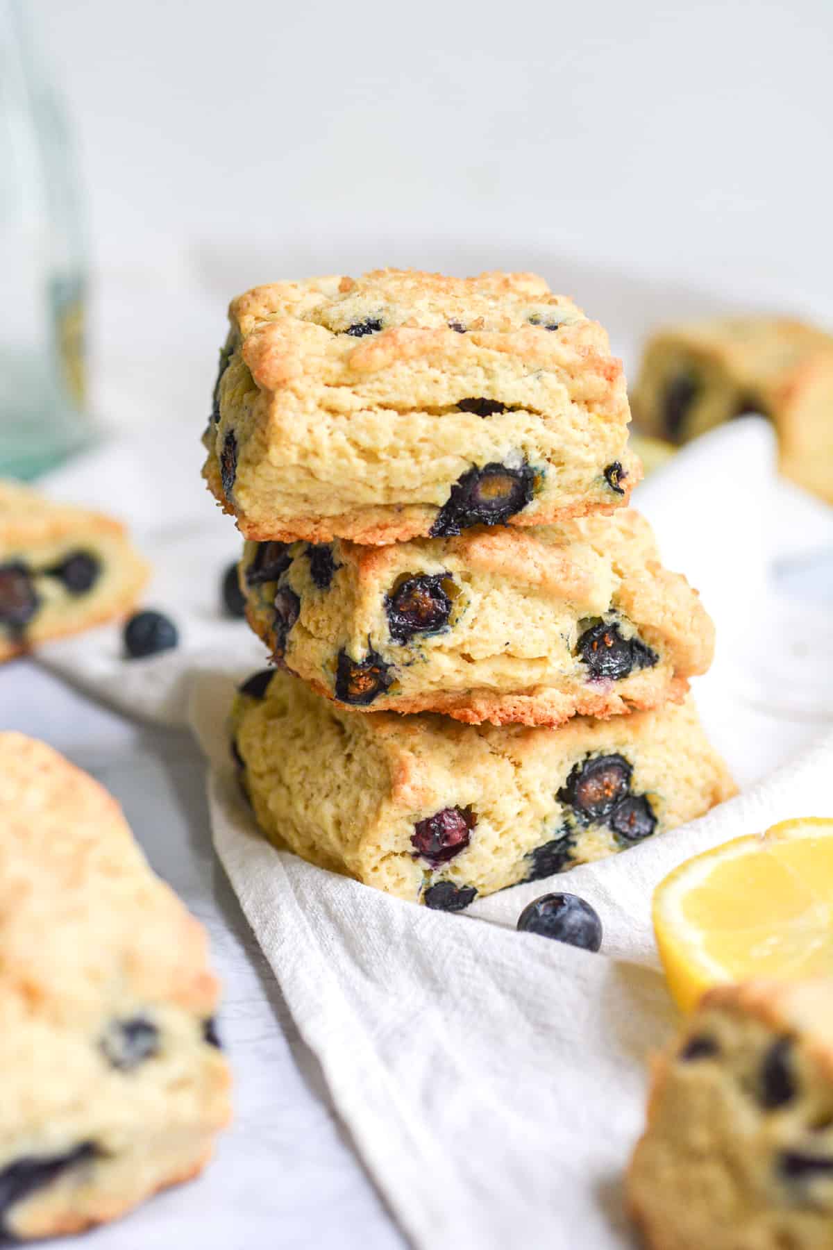 3 eggless vegan blueberry scones stacked on top of each other
