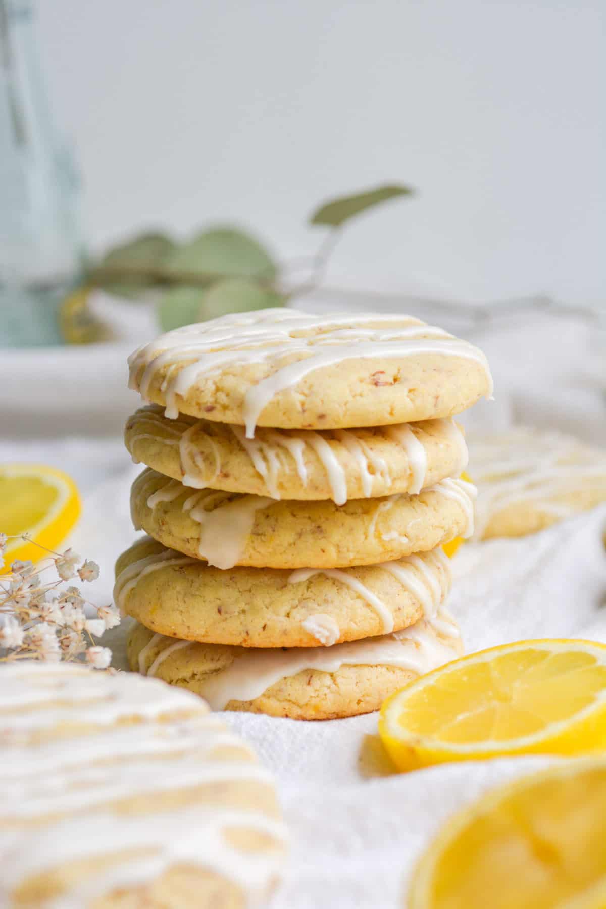 stack of four iced vegan lemon sugar cookies