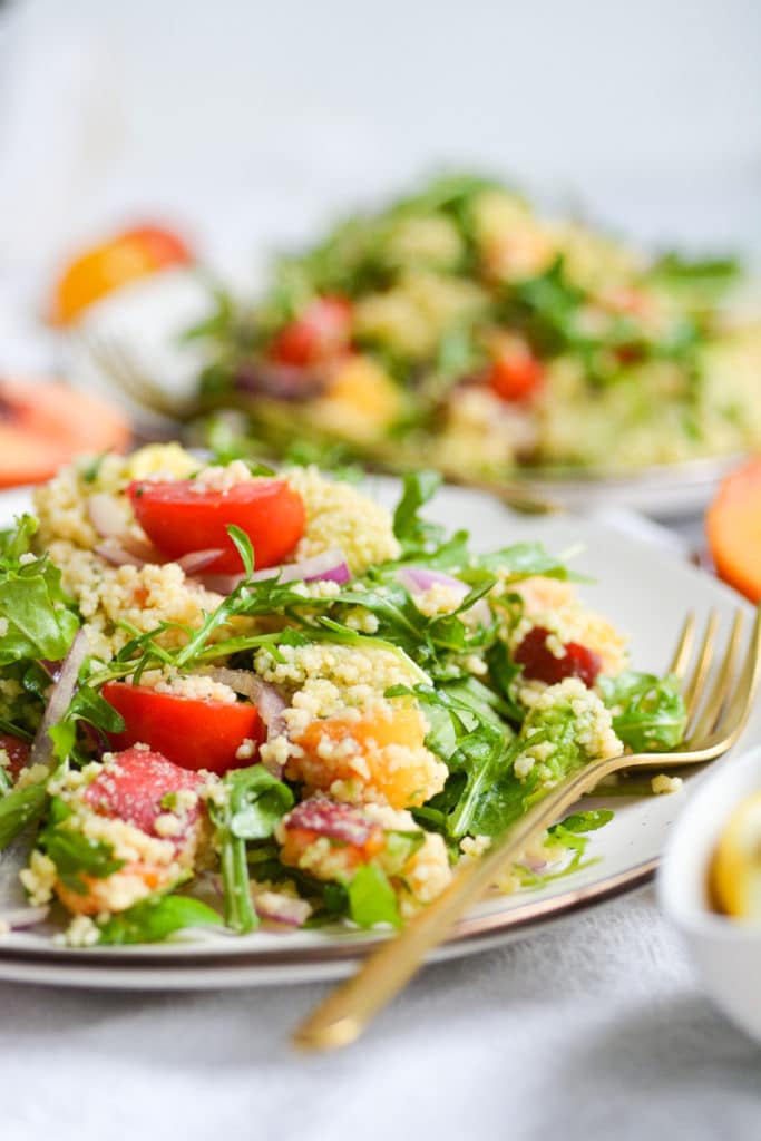two plates of vegan couscous salad