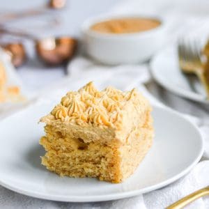 A piece of vegan peanut butter cake on a gold plate