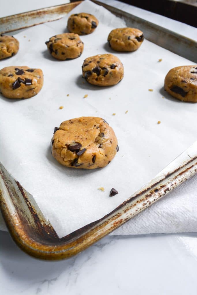 Cookie dough balls on a baking sheet
