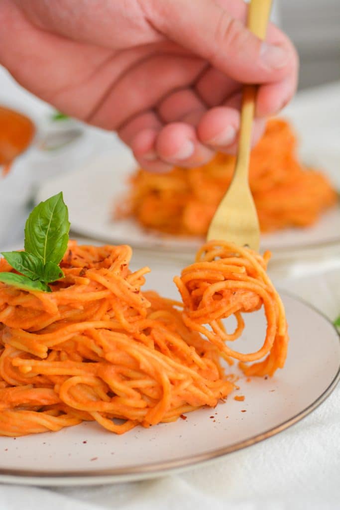 A forkful of creamy vegan pasta