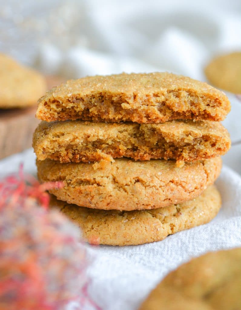 A vegan brown sugar cookie broken in half to show the chewy interior