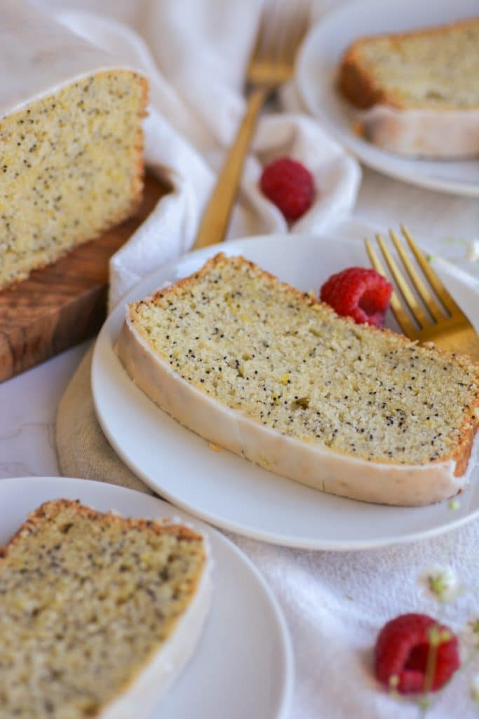 Portrait of plates with slices of Vegan Lemon Poppyseed Cake